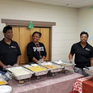 Volunteers serve breakfast to the families in Hagar’s House